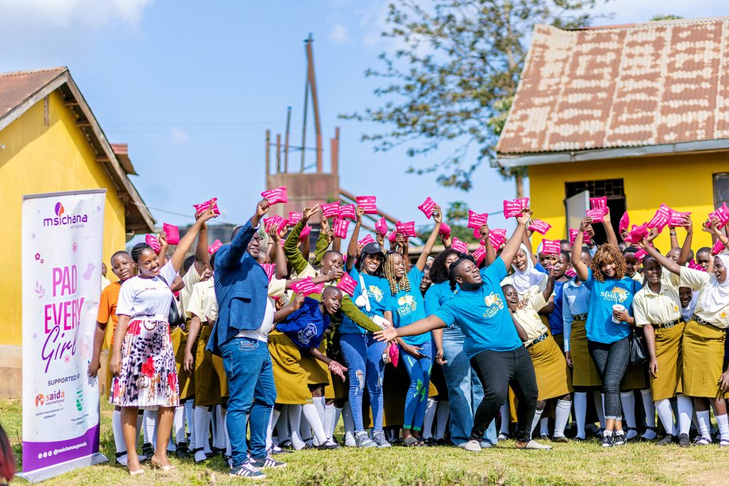 Group picture with students holding pads